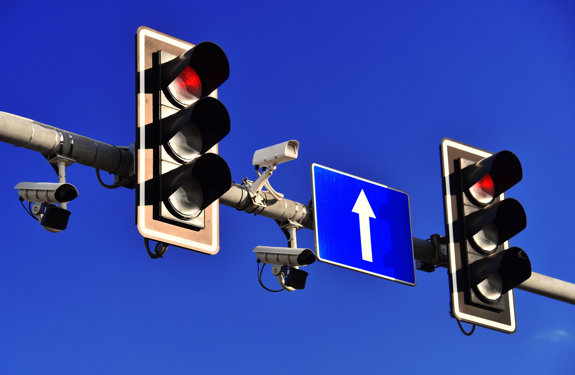 Traffic lights over blue sky